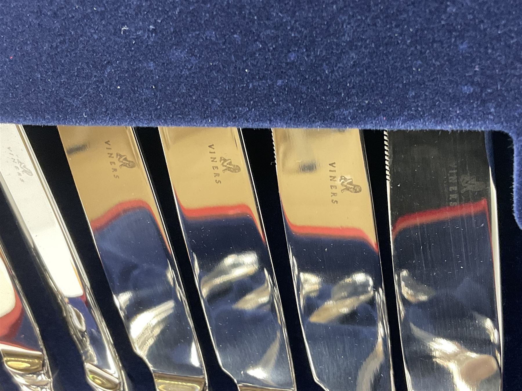 Viners Emassy canteen of Sheffield silver plated cutlery, 58 pieces, comprising eight table knives, dessert knives, dessert spoons, teaspoons, table forks, dessert forks, soup spoons, and two table spoons, housed in case with hinged lift up lid raised on four feet, L45cm