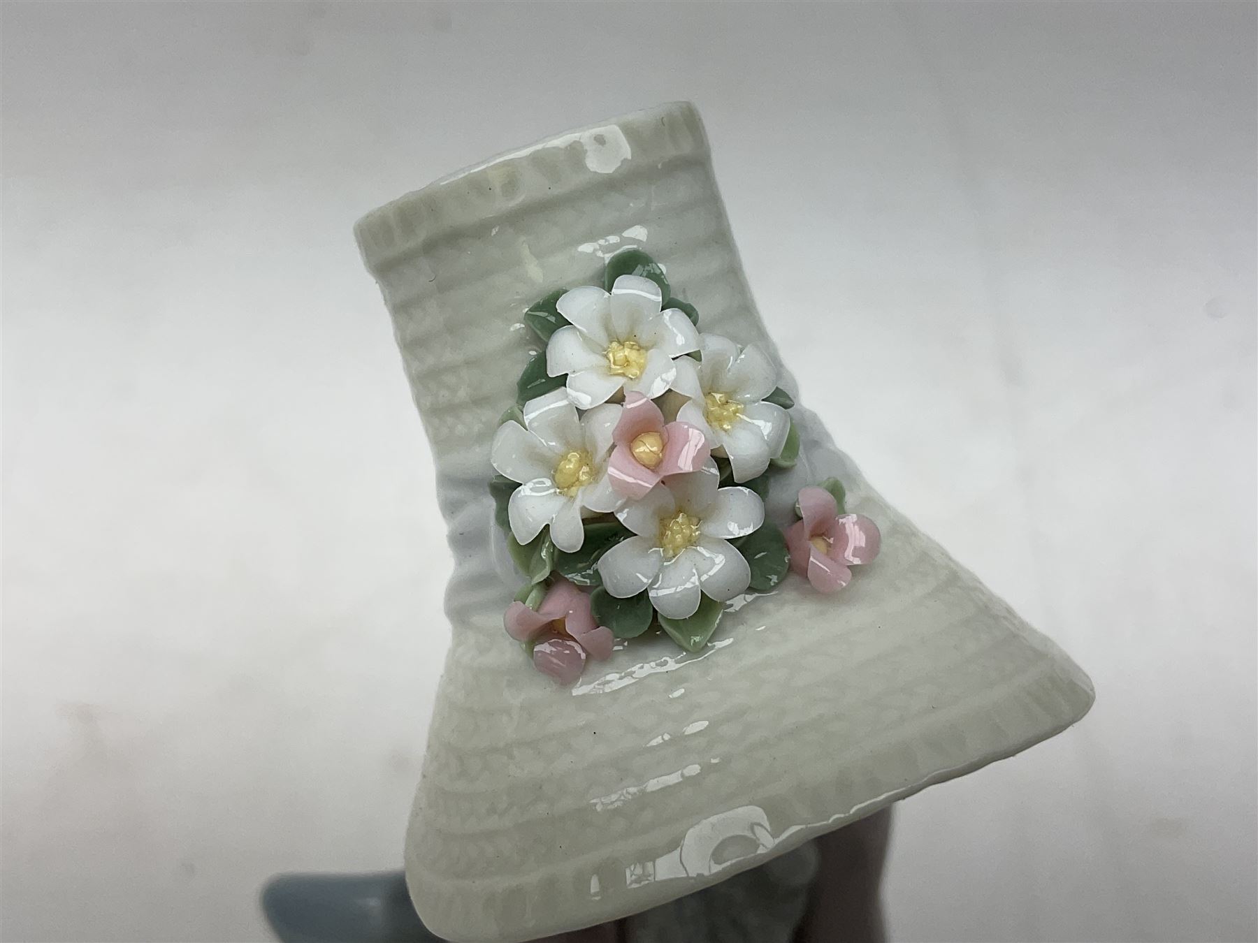 Two Lladro figures, comprising Garden Classic, no 7617 and Garden Song, no 7618, with original boxes and artists signature beneath, largest example H23cm