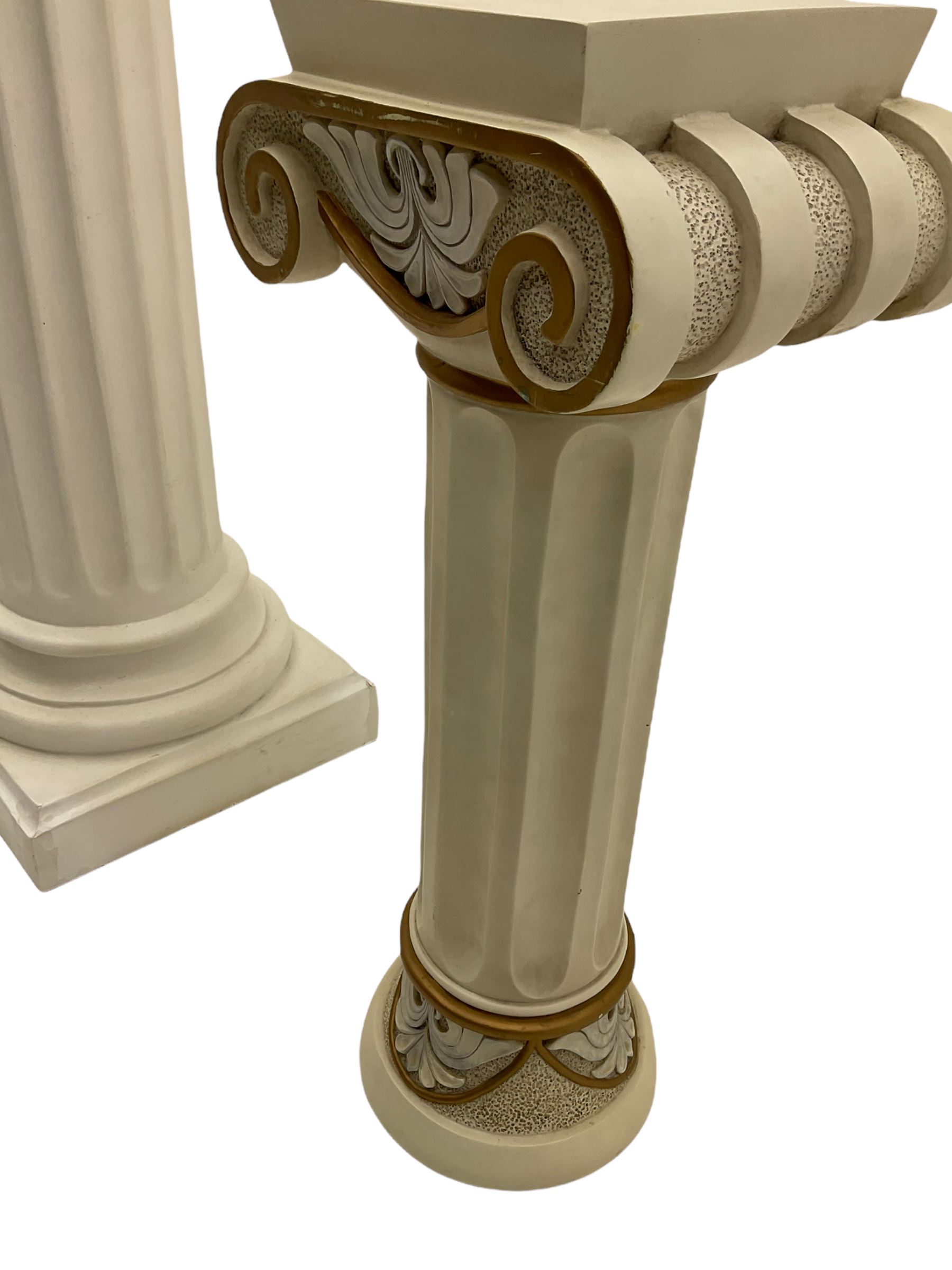 Classical Ionic style column in white finish with scrolled capital, fluted body on moulded plinth base (H97cm), and a similar small column stand (H68cm)