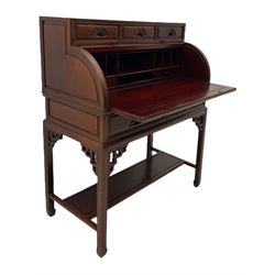 Hardwood cylinder desk, three drawers raised over curved lid, fitted interior with slide, the supports joined by undertier with fret work brackets 