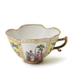 Collection of Helena Wolfsohn Dresden porcelain works, comprising a quatrefoil dish, D24cm, a chocolate cup with socketed saucer, two teacups, one with saucer, and a pair of twin-handled covered cups, each decorated with panels of flowers and courting scenes, various blue marks to bases