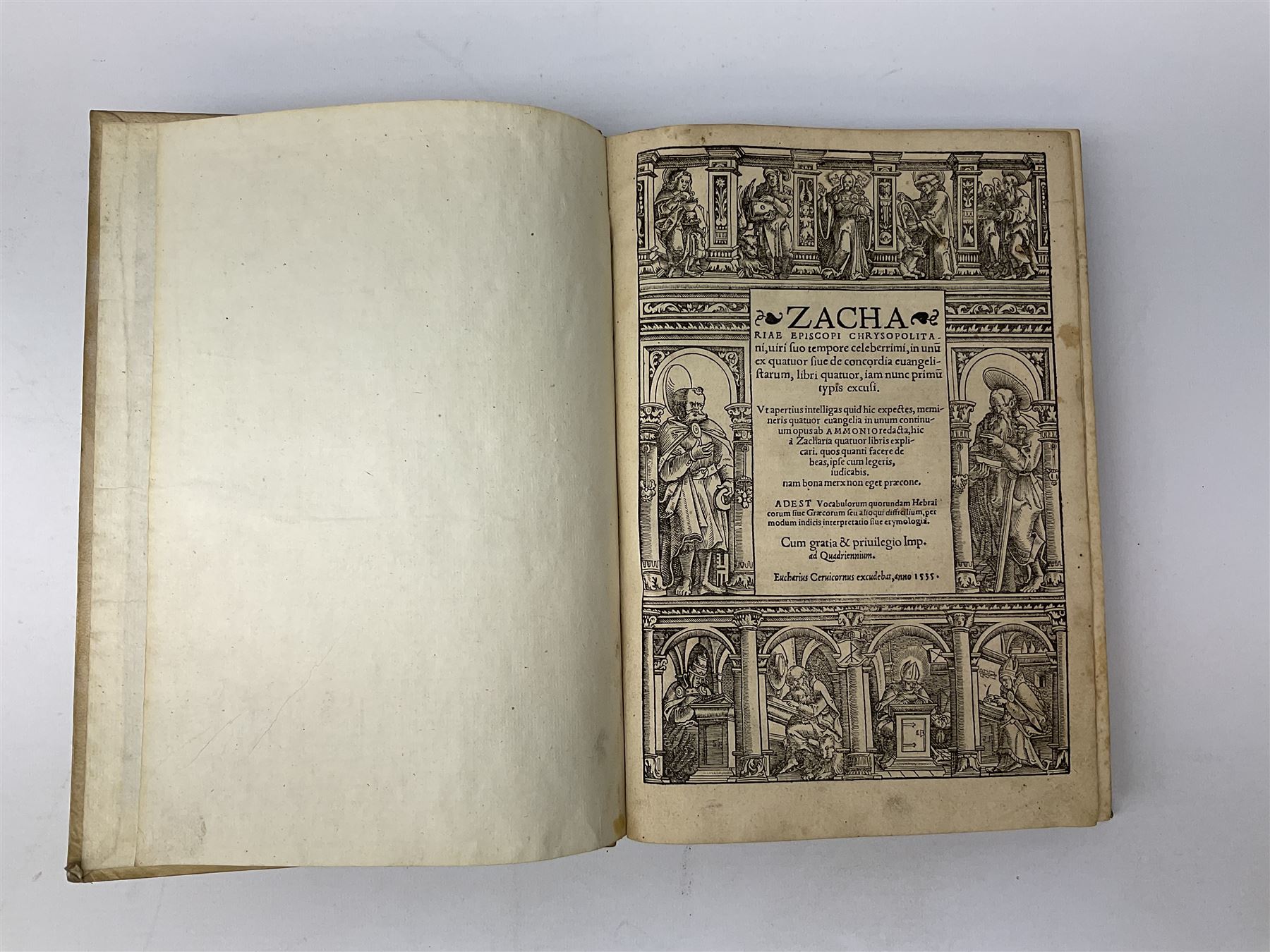 Zacha Riae Episcopi Chrysopolita Ni, Uiri Suo Tempore Celeberrimi, In Unu Ex Quatuor Fiue De Concordia Evangelistarum, Libri Quatuor, Iam Nunc Primu Typis Excusi .... 1535 Eucharius Ceruicornus Excudebat. Title page with border of engraved figures. Later full vellum binding.