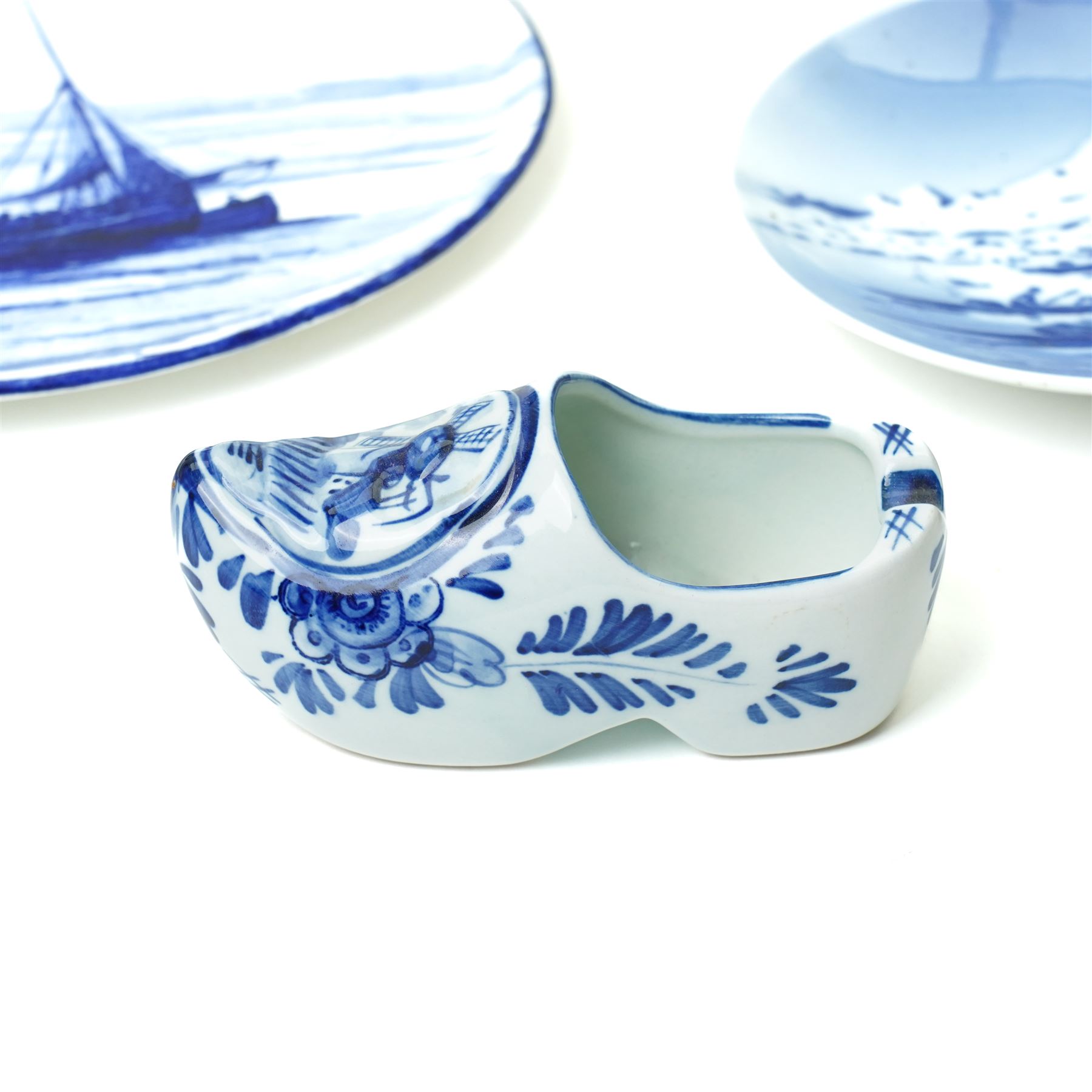 Royal Copenhagen onion pattern low comport, three breakfast cups and five saucers, oval platter, four tea plates, Munich 1972 Olympics plate, and four other blue and white items