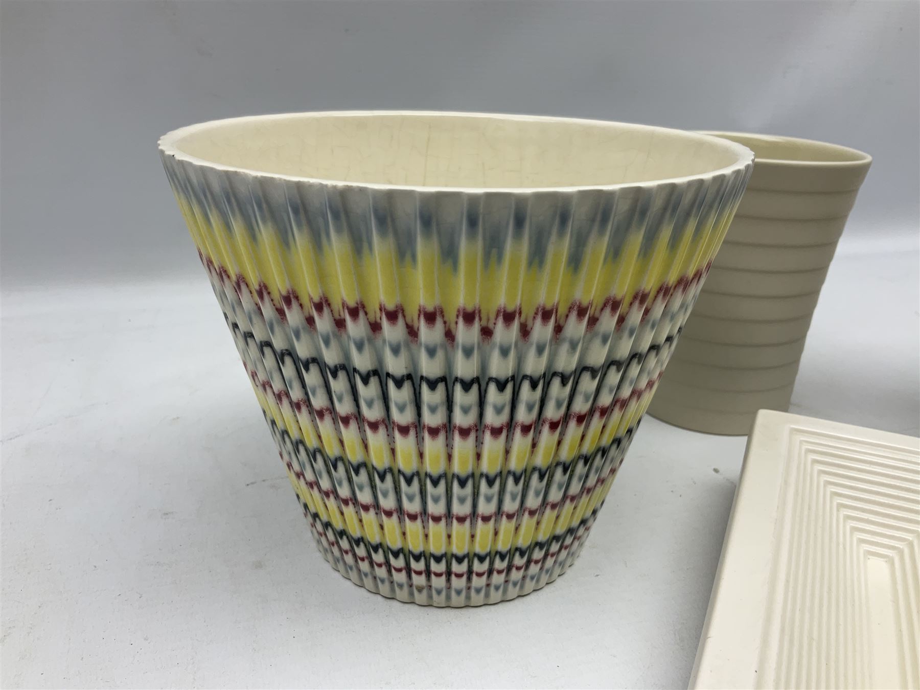 Hornsea Pottery Rainbow planter by John Clappison, together with two Horsea Concept vases with flower holders and Hornsea Stadium dish, largest example H16cm