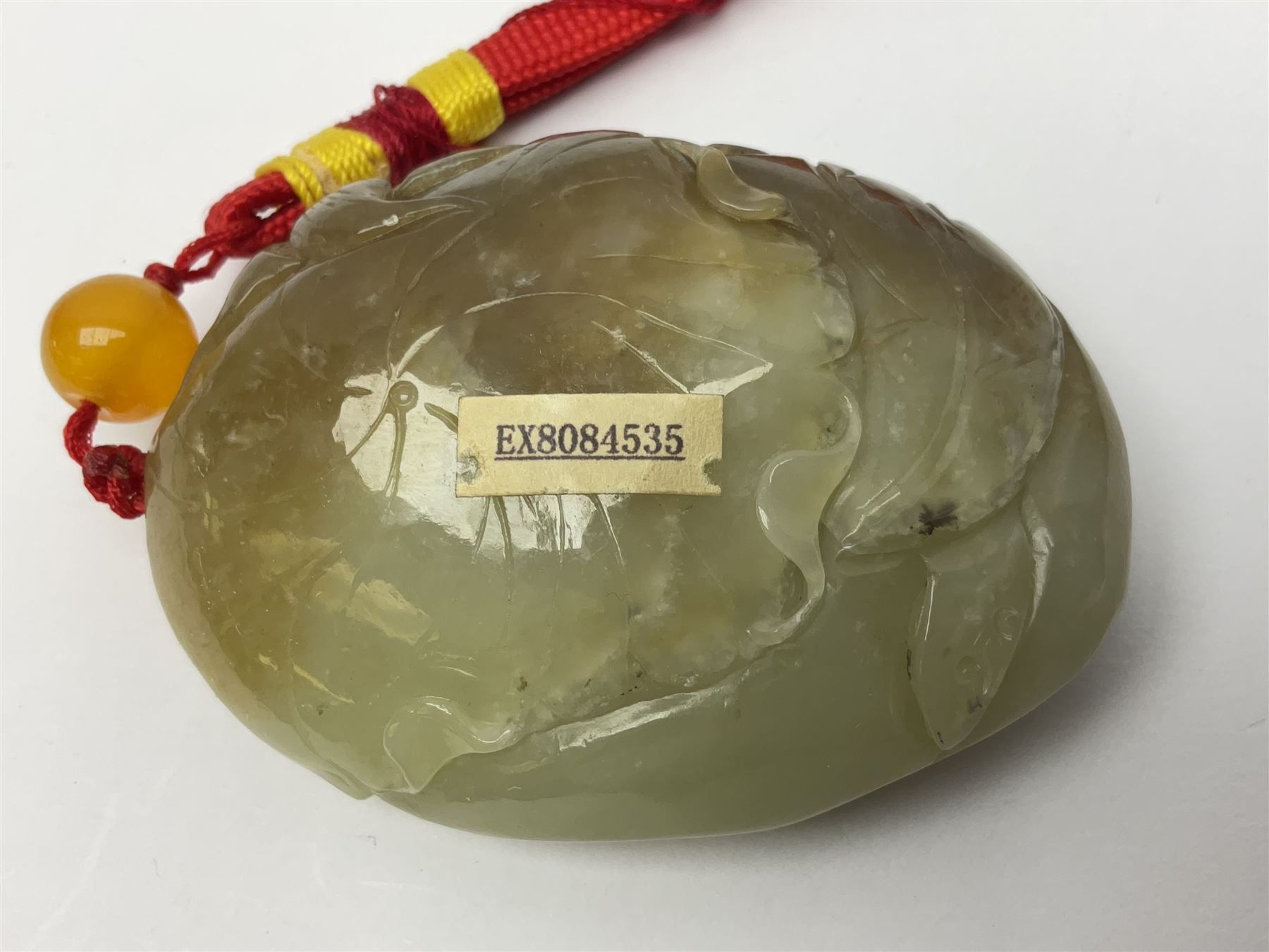 Chinese hardstone carving of a fish amongst coral, with platted rope handle, together with other hardstone and soft stone carvings  