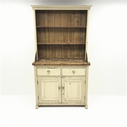  Solid pine dresser in painted cream finish, raised two tier plate rack above two drawers and two cupboards, arched sledge feet, W112cm, H204cm, D51cm  