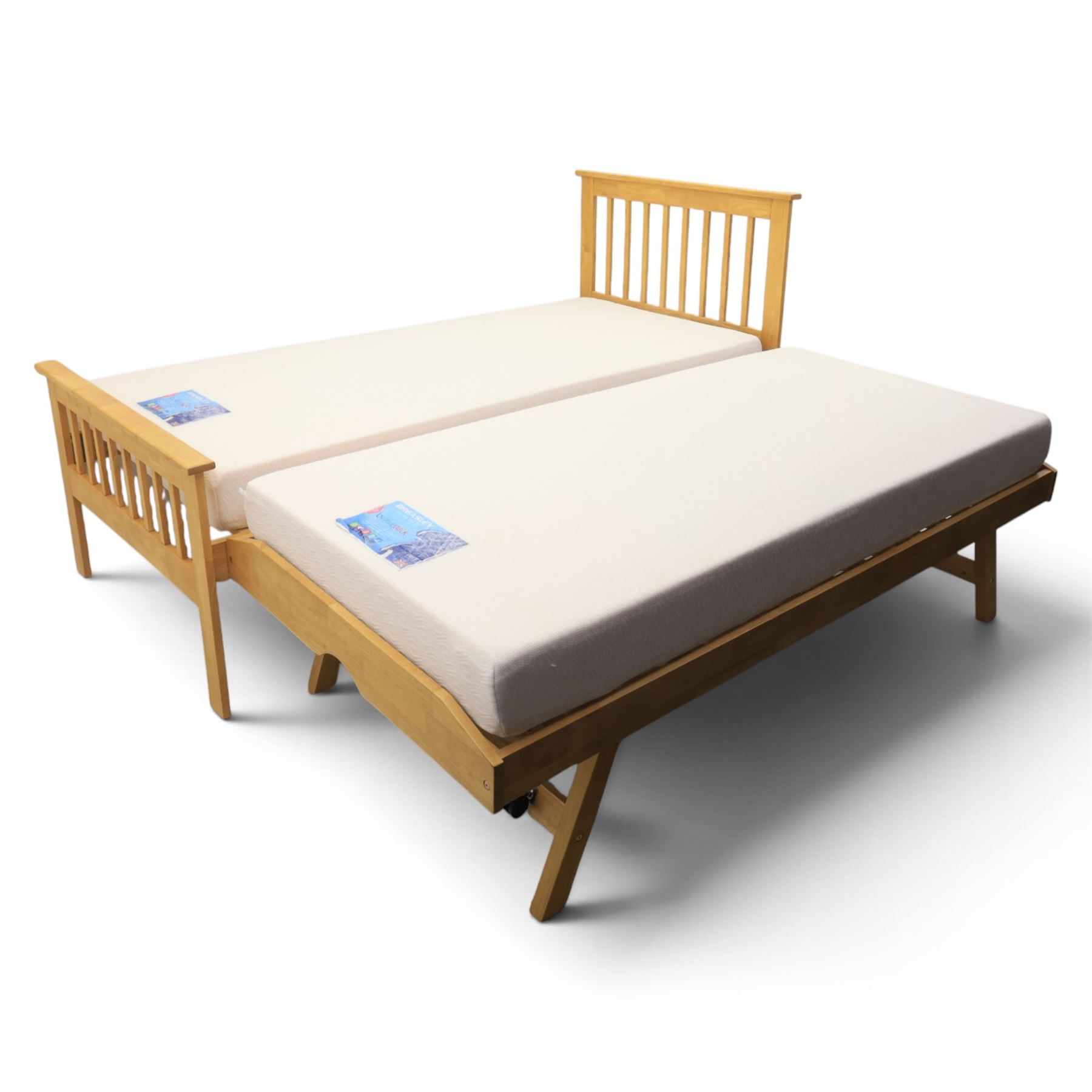 Contemporary light oak trundle bed, slatted headboard and footboard,  incorporating pull-out trundle bed on castors, complete with two memory foam mattresses
