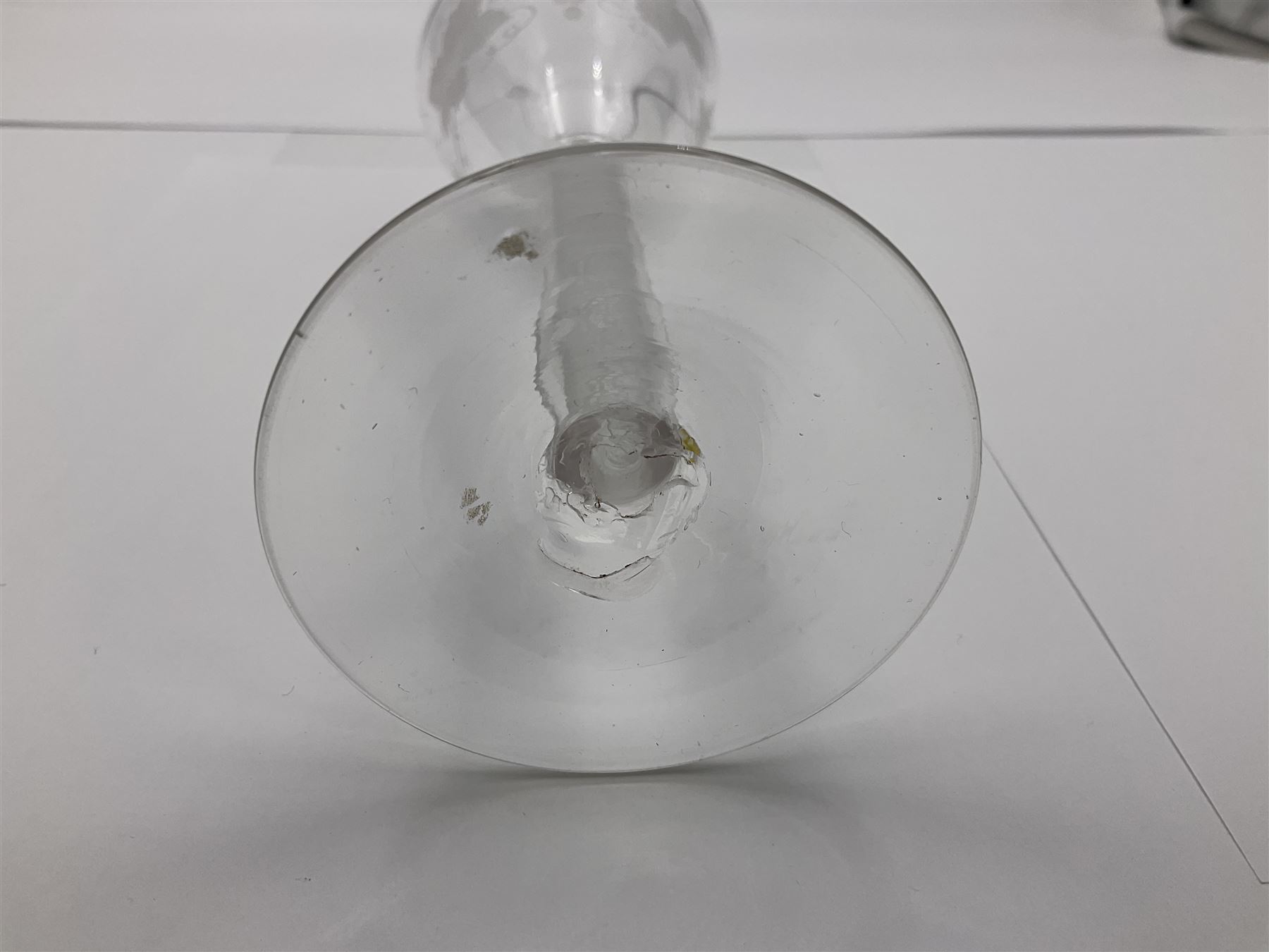 Set of three 18th century style wine glasses, each with funnel bowl etched with fruit vine, upon a double series air twist stem and circular foot, H17cm