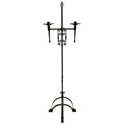Ironwork candle holder stand, with stamped decoration, adjustable two branch sconces with scrolled iron work, twist stem with arched supports with scrolled terminals