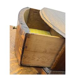 Late 19th century continental oak commode, serpentine fronted with parquetry and crossbanded decoration, the raised superstructure back fitted with a central bank of five recessed drawers flanked by concave drawers, above three full-width drawers with brass ring handles, raised on cabriole supports