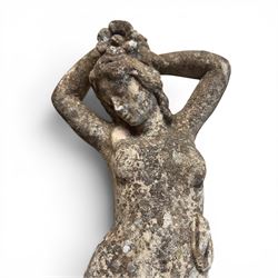 Two composition stone garden figures, comprising a seated boy figure and a standing classical draped female figure, each on square base, weathered painted finish.