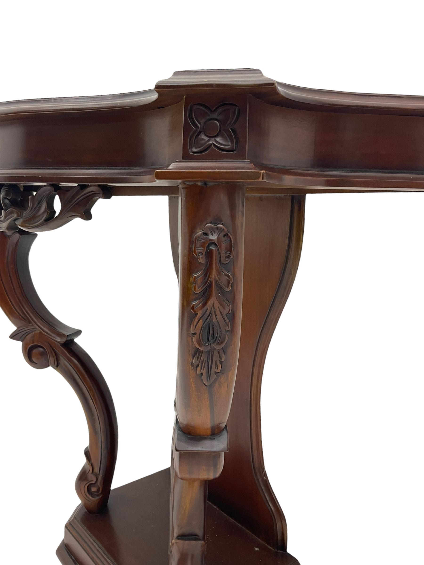 Victorian style mahogany console table, shaped moulded top on scrolled supports, moulded and canted base (W91cm, H76cm, D41cm), and a reproduction mahogany console or side table on reeded supports 