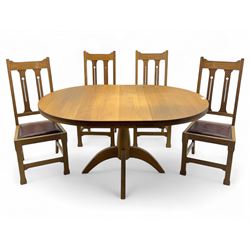 Contemporary light oak round extending dining table with four chairs, table has fold out l...