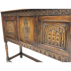 17th century style caved oak side cabinet, fitted with two cupboards, stretcher base