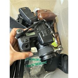 Collection of cameras and camera equipment, including Voigtlander Vitomatic I, Nikon Coolpix P340, Nikon Coolpix S9100, Olympus SP-510UZ, tripod, cases, etc