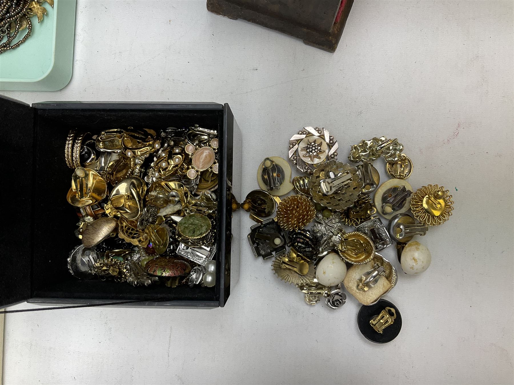 Collection of costume jewellery including enamel and marcasite flower brooch, two V Villani Italy bangles, clip on earrings, brooches, bangles, beaded necklaces and a Skagen wristwatch