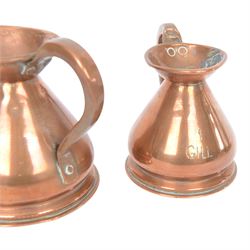 Copper and brass measures, including set of three copper jugs, set of four graduating brass pans and two sets of copper and brass cup measures