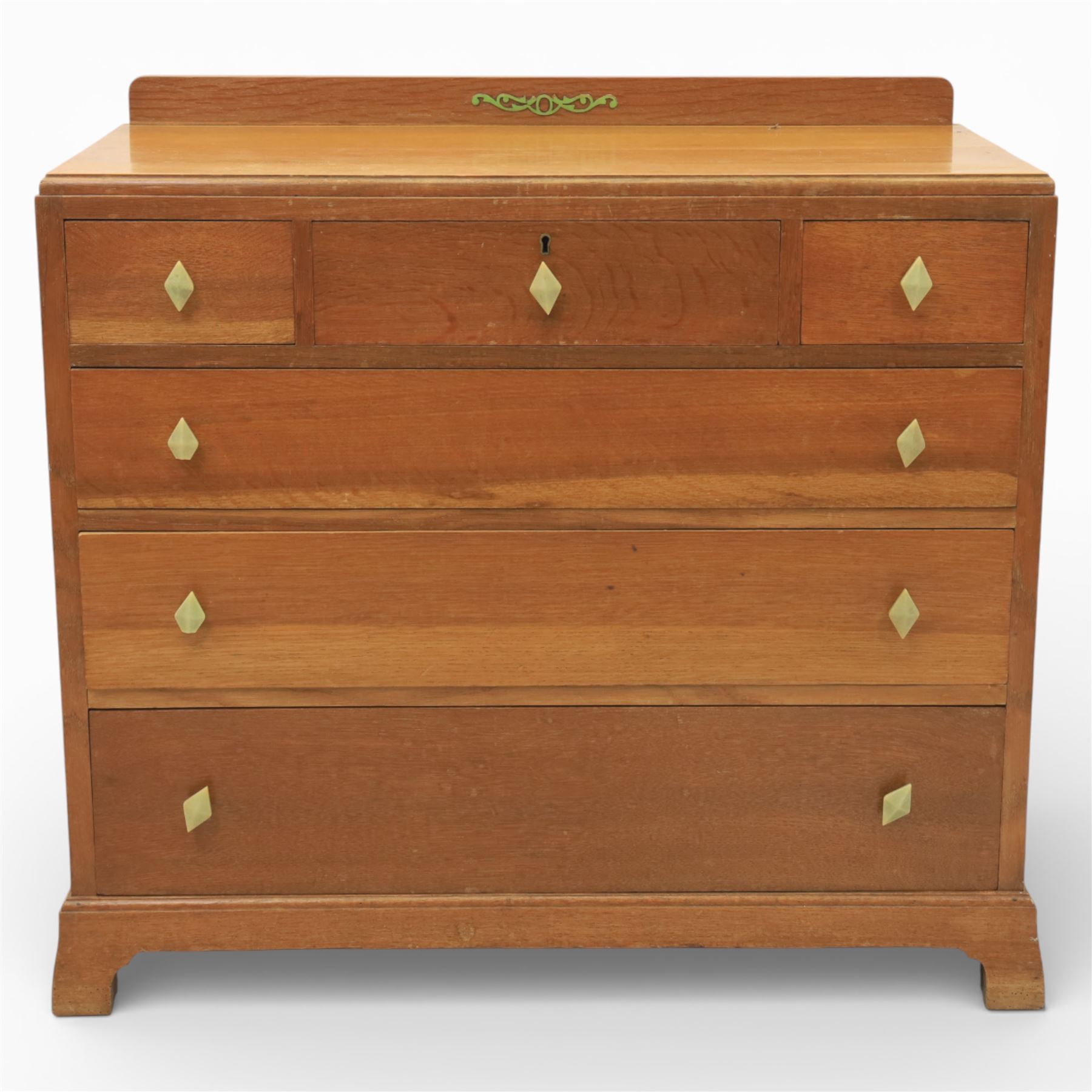 Early 20th century Art Deco bedroom suite, comprising double wardrobe, dressing table and chest of drawers, constructed in walnut with figured veneers and geometric banding, the wardrobe with arched top and panelled doors enclosing a fitted interior, the dressing table with rectangular top below a three panel mirror arrangement, fitted with two short over two long drawers, the chest with three short and three long drawers, each piece fitted with faceted handles and raised on shaped feet
Wardrobe (H 177cm, D 46cm, W 112cm)
Chest (H 85cm, D 48cm, W 92cm)
Dressing table (H 160cm, D 52cm, W 106cm)
