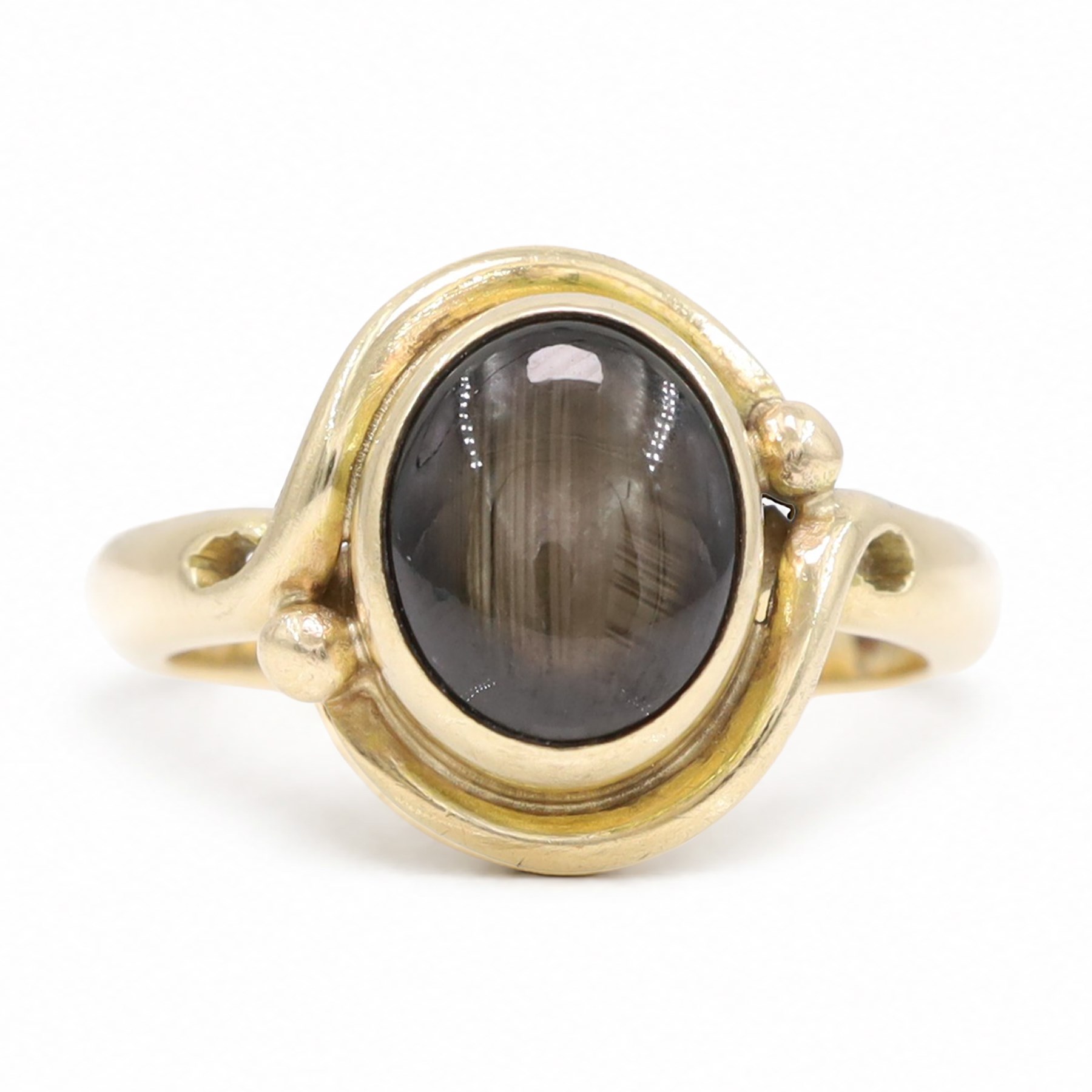 9ct gold black sapphire ring, bezel set with a single cabochon cut sapphire, London 1996