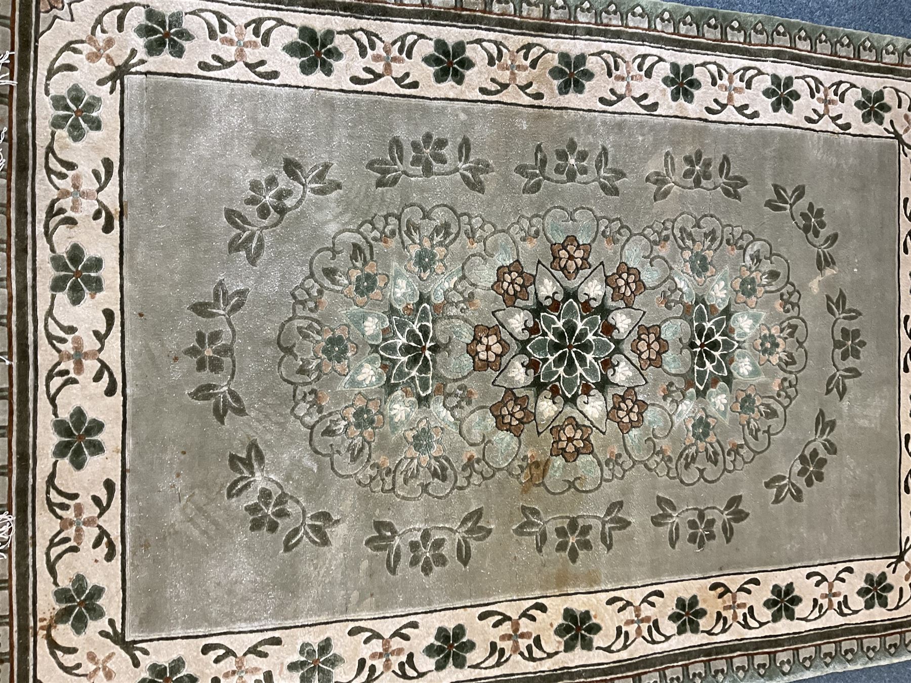 Three Chinese washed woollen rugs - circular blue ground decorated with dragons (D160cm), rectangular light green rug (185cm x 123cm), and a rectangular green rug (185cm x 123cm)