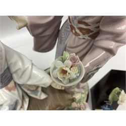 Lladro figure, Springtime in Japan, modelled as two Geisha on a bridge with a crane, sculpted by Salvador Debon, together with four Lladro flowers, Dahlia no 5180, White Camelia no 5181, White Carnation no 5184 and Chrysanthemum no 5189, largest example H32cm