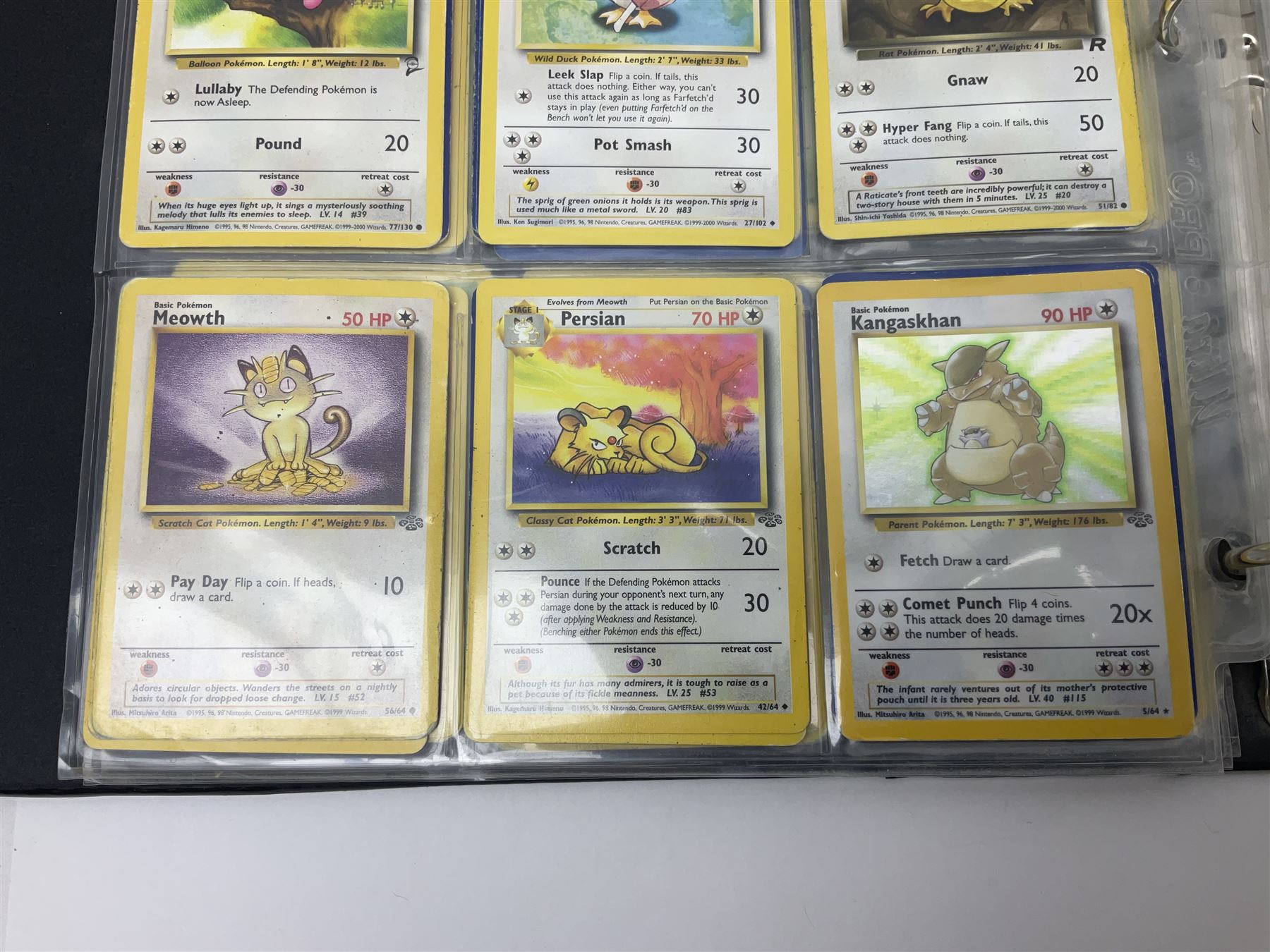 Collection of Pokemon trading cards, mostly 1999 Wizards Pokemon cards to include holo Charizard 4/102, first edition holo Machamp 8/102, further holographic cards; Dark Flareon 35/82 and Dark Vaporeon 45/82, cards from themed sets and 4th edition prints; 1998 Electronic Pokédex with cardboard boxes for themed decks Blackout, Overgrowth and Power Reserve Jungle, along with a large quantity of energy and trainer cards 