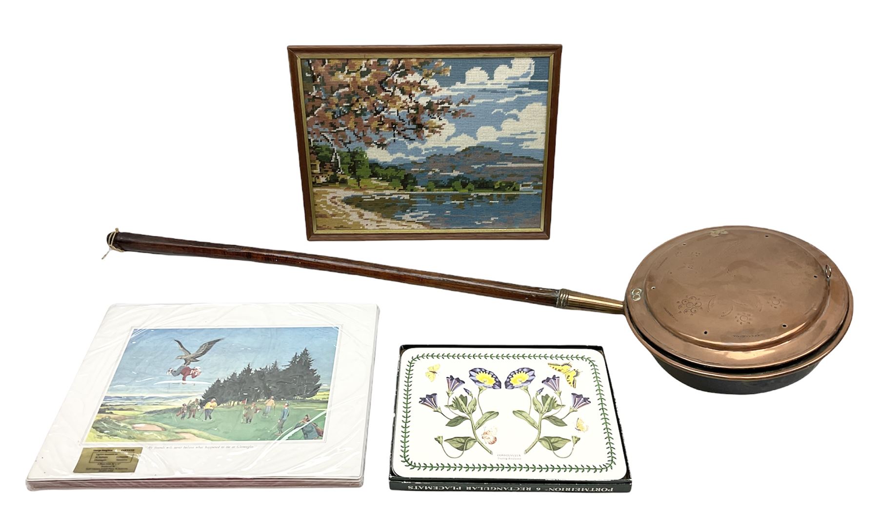 Copper bed pan, Portmeirion placemats, glazed and framed needlework and George Houghton cartoons placemats