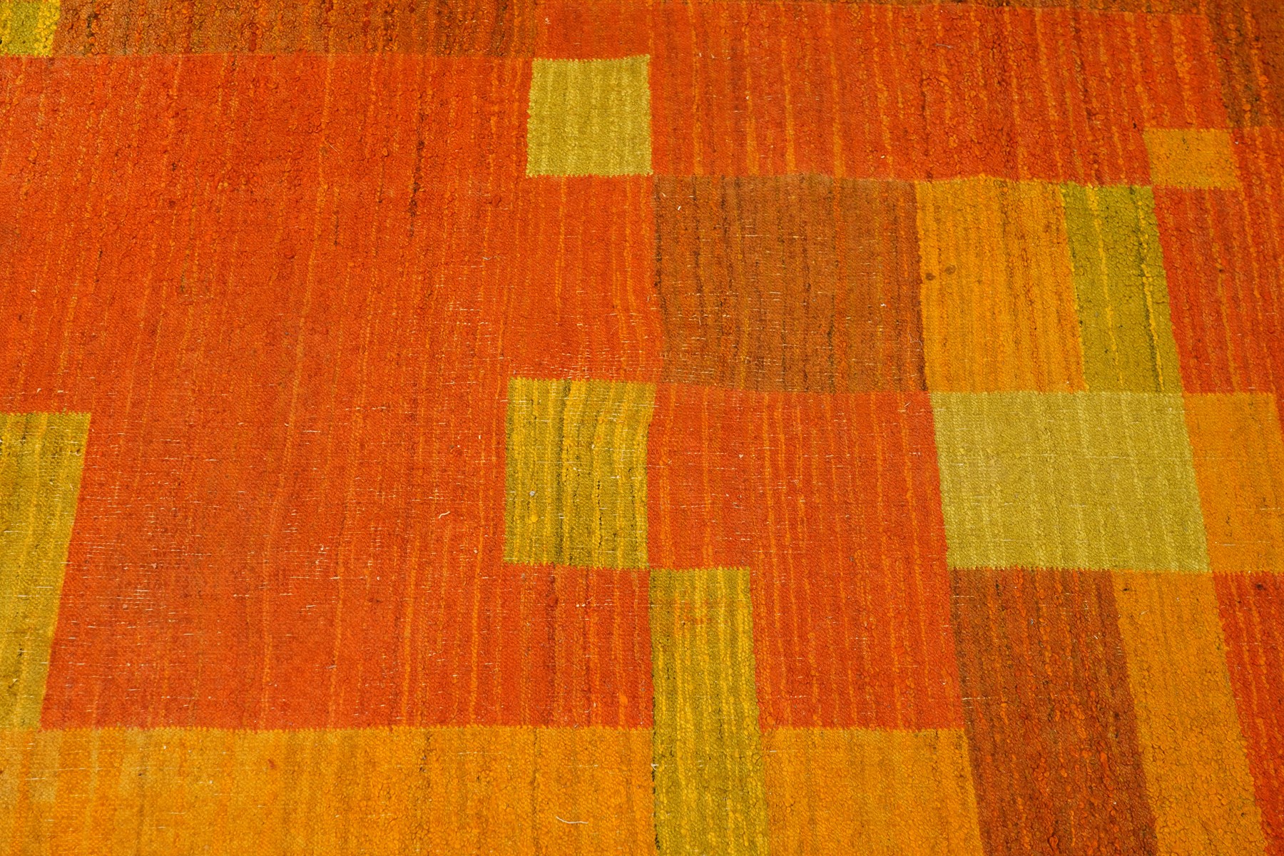 Vintage handwoven modernist rug with cubist design in contrasting tones of amber and orange