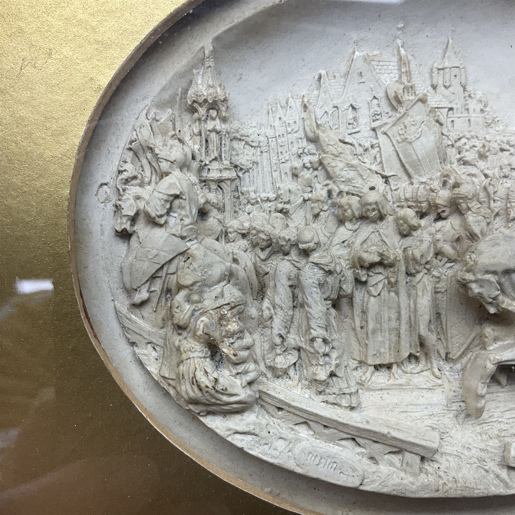 Justin Mathieu, two oval high relief plaque depicting a battle scenes, each within a wooden frame, frame  H21cm, L25cm