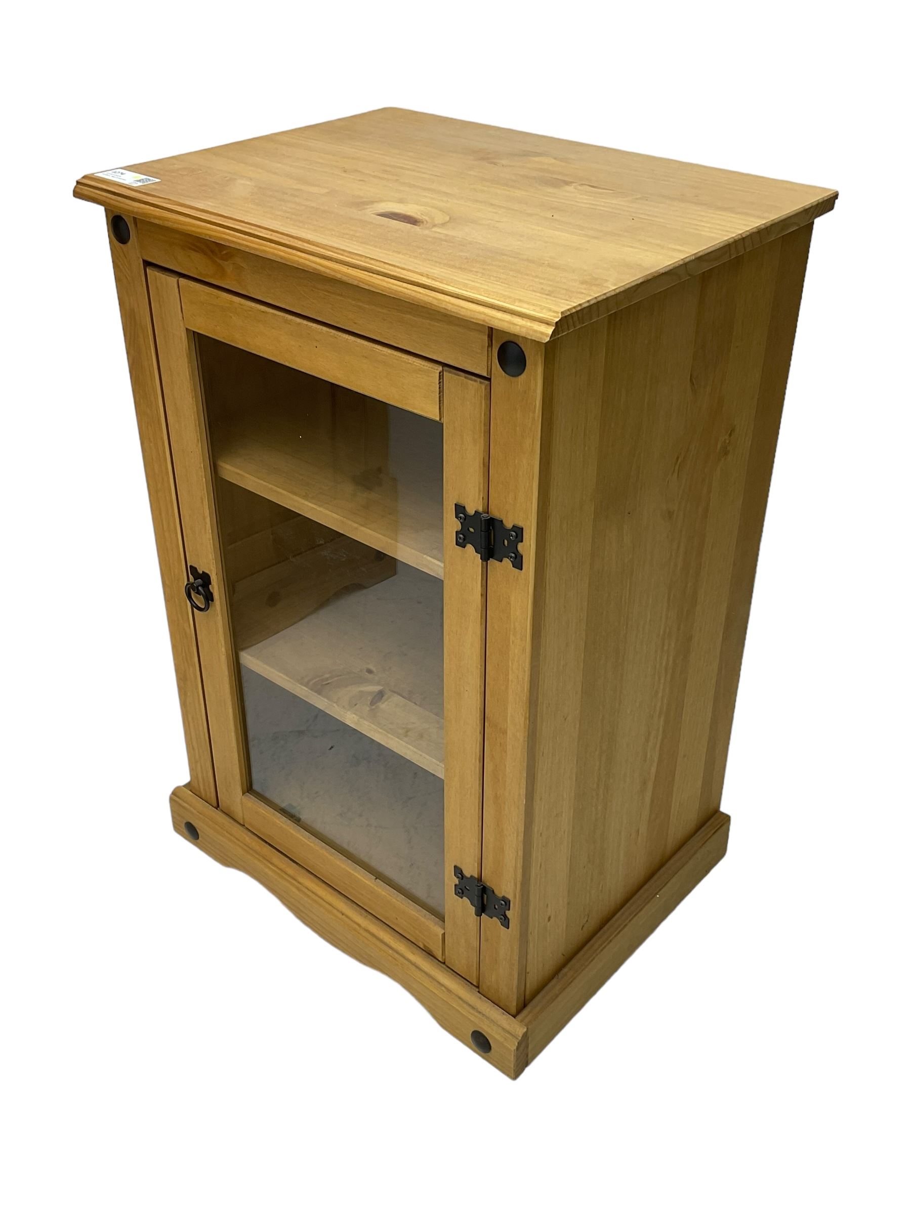 Pine media or television cabinet, enclosed by single glazed door (W56cm, H82cm, D43cm); pine corner cupboard, three shelves over single cupboard (W76cm, H188cm); pine two-tier plate rack with shaped frieze and uprights (W113cm, H107cm)