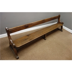  19th century oak ecclesiastical church oak pew, shaped chamfered end supports carved with foliage connected by floor stretcher, W245cm, H70cm, D52cm  