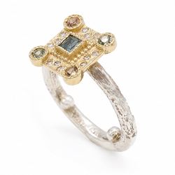 18ct gold and silver blue topaz, sapphire diamond dress ring, square cut blue topaz, surrounded by round brilliant cut diamonds, the corners set with green and orange / brown sapphires,stamped 18K 925
