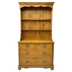 Victorian pine dresser, the shaped frieze over a two-tier pate rack, the basefitted with two short over two long drawers