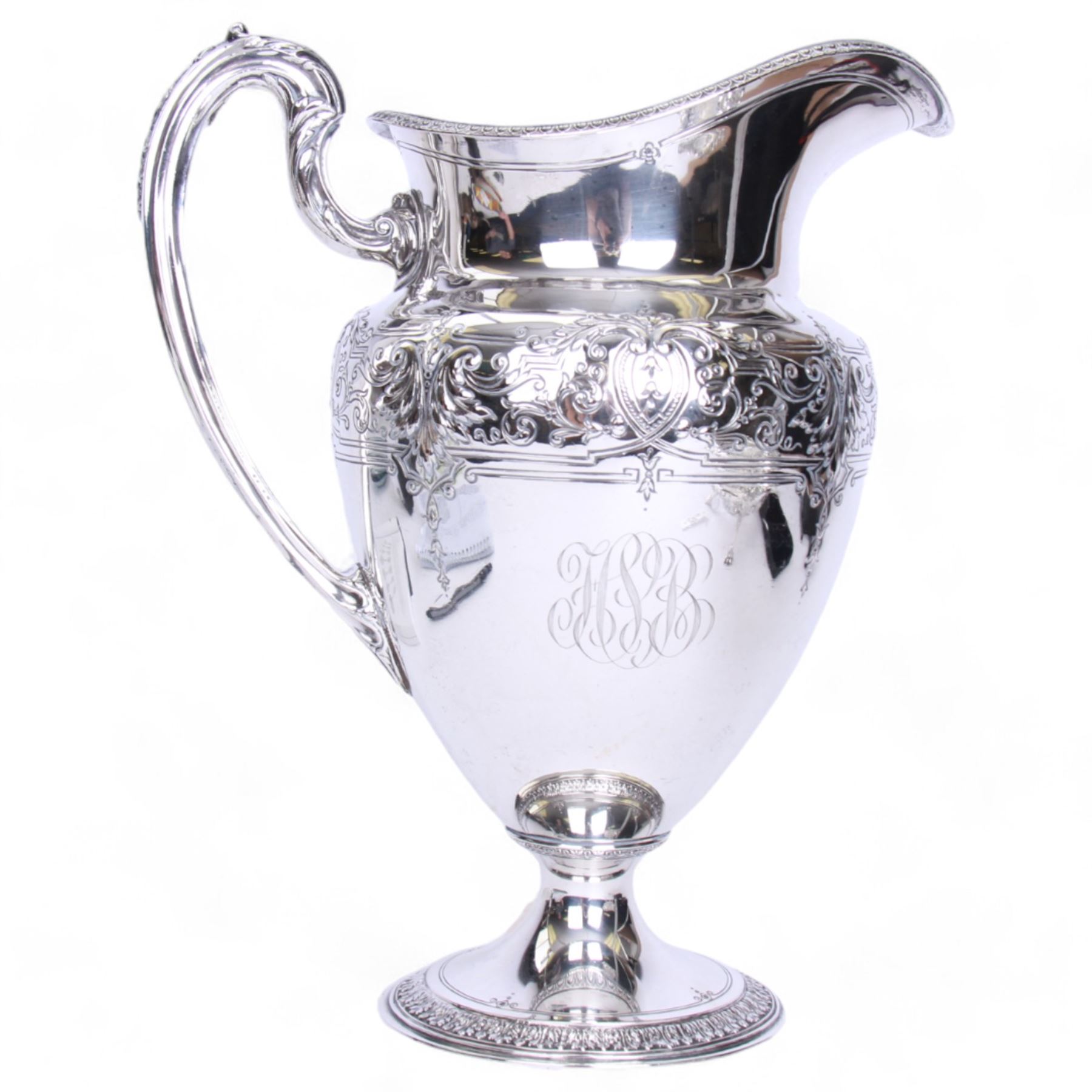 Large late 19th/early 20th century American silver pitcher, the body of ovoid form with embossed and chased foliate band, and acanthus capped scroll handle, upon a spreading circular foot with stiff leaf border, marked for Reed & Barton, Taunton, Massachusetts, and stamped Sterling, H27cm

