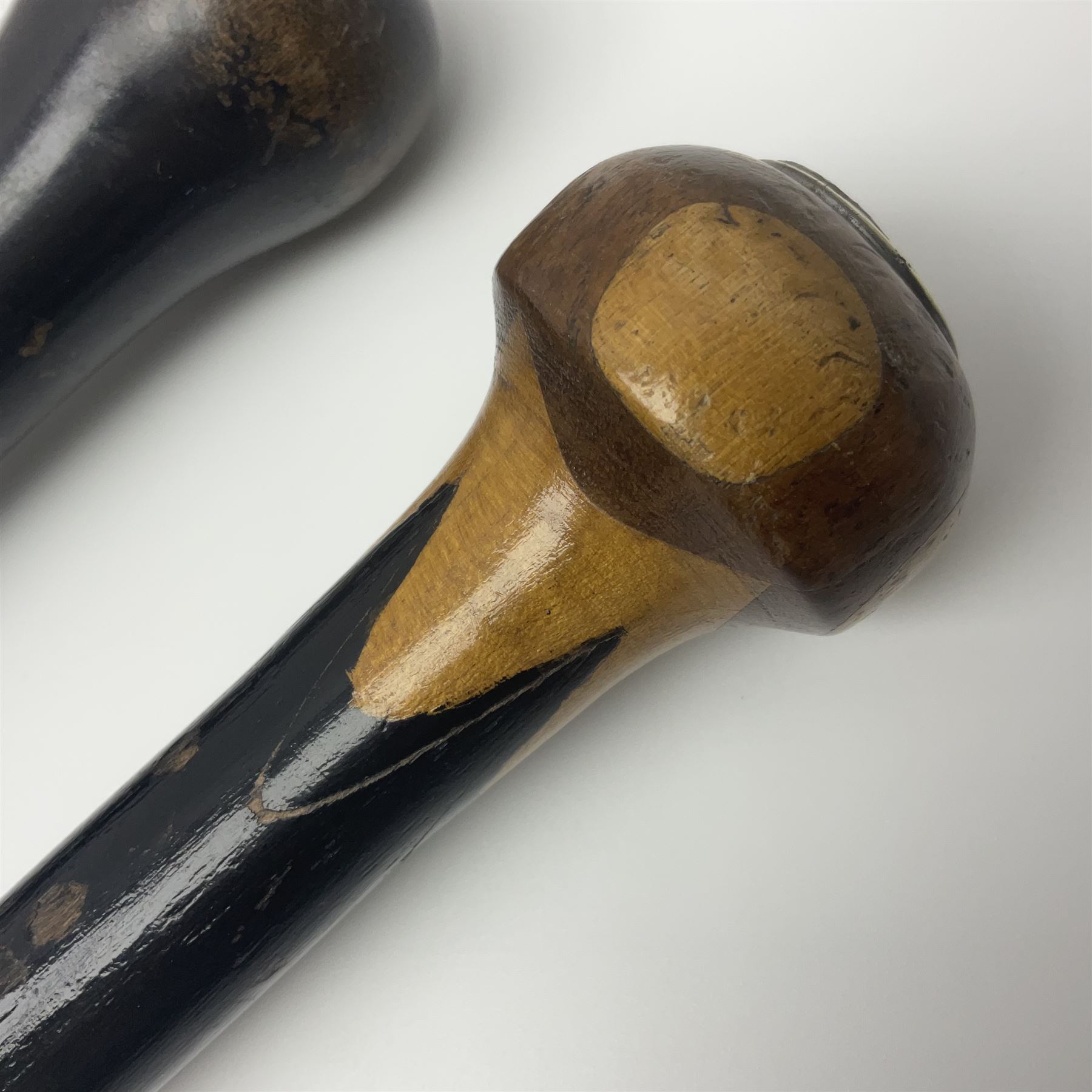 Two ebonised walking sticks, one with 'Leeds City Police' embossed top, tallest H92cm