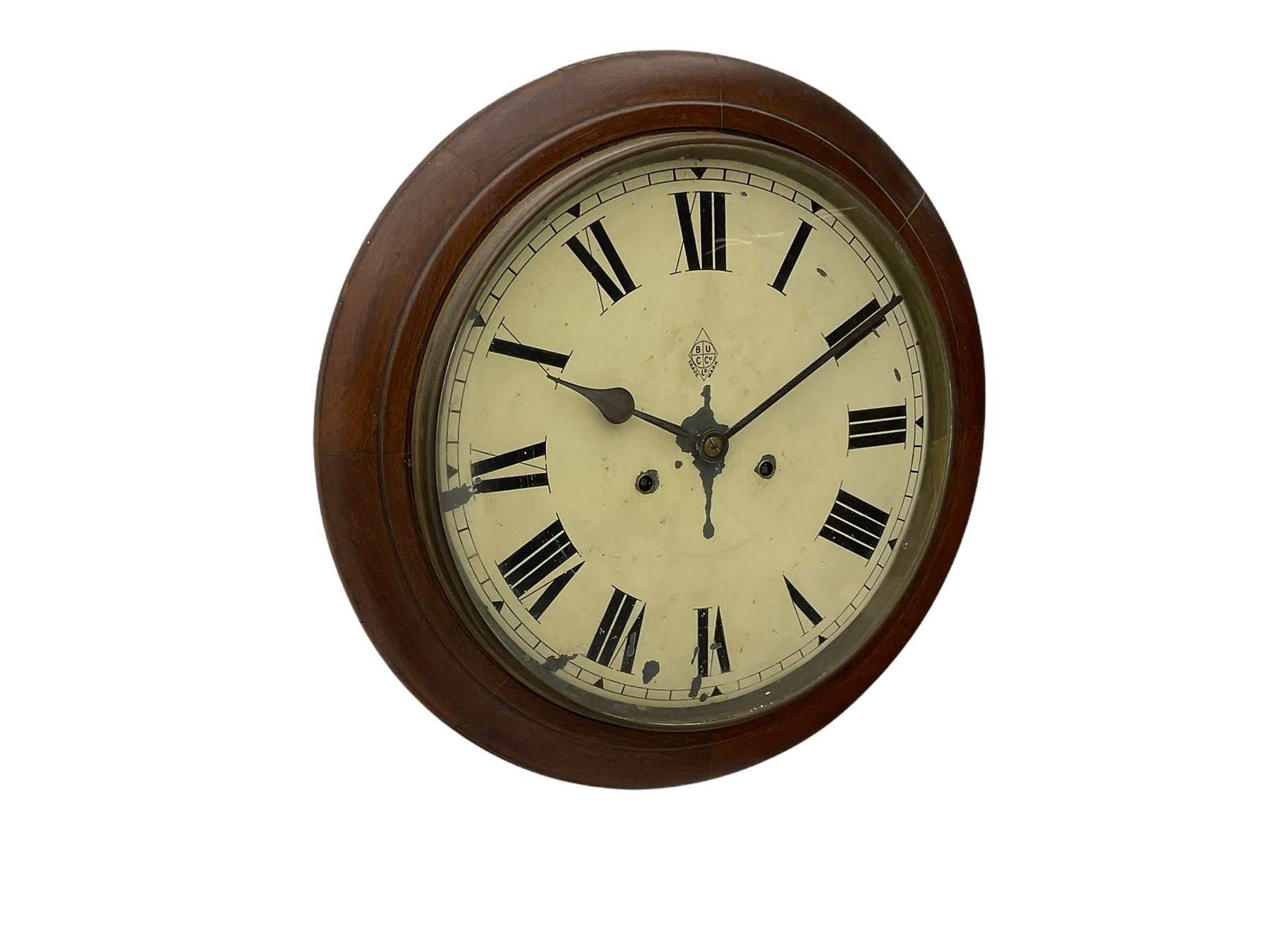 An early 20th century English wall clock with a circular 16” mahogany wooden bezel, 12” painted steel dial with Roman numerals and minute track, steel spade hands within a flat glass and spun brass bezel, eight-day rack-striking spring driven movement striking the hours on a coiled gong, with case side door and pendulum regulation door to base, dial inscribed with the trademark BUC Ltd . 
( British United Clock Company 1885-1909)
With pendulum and key.



