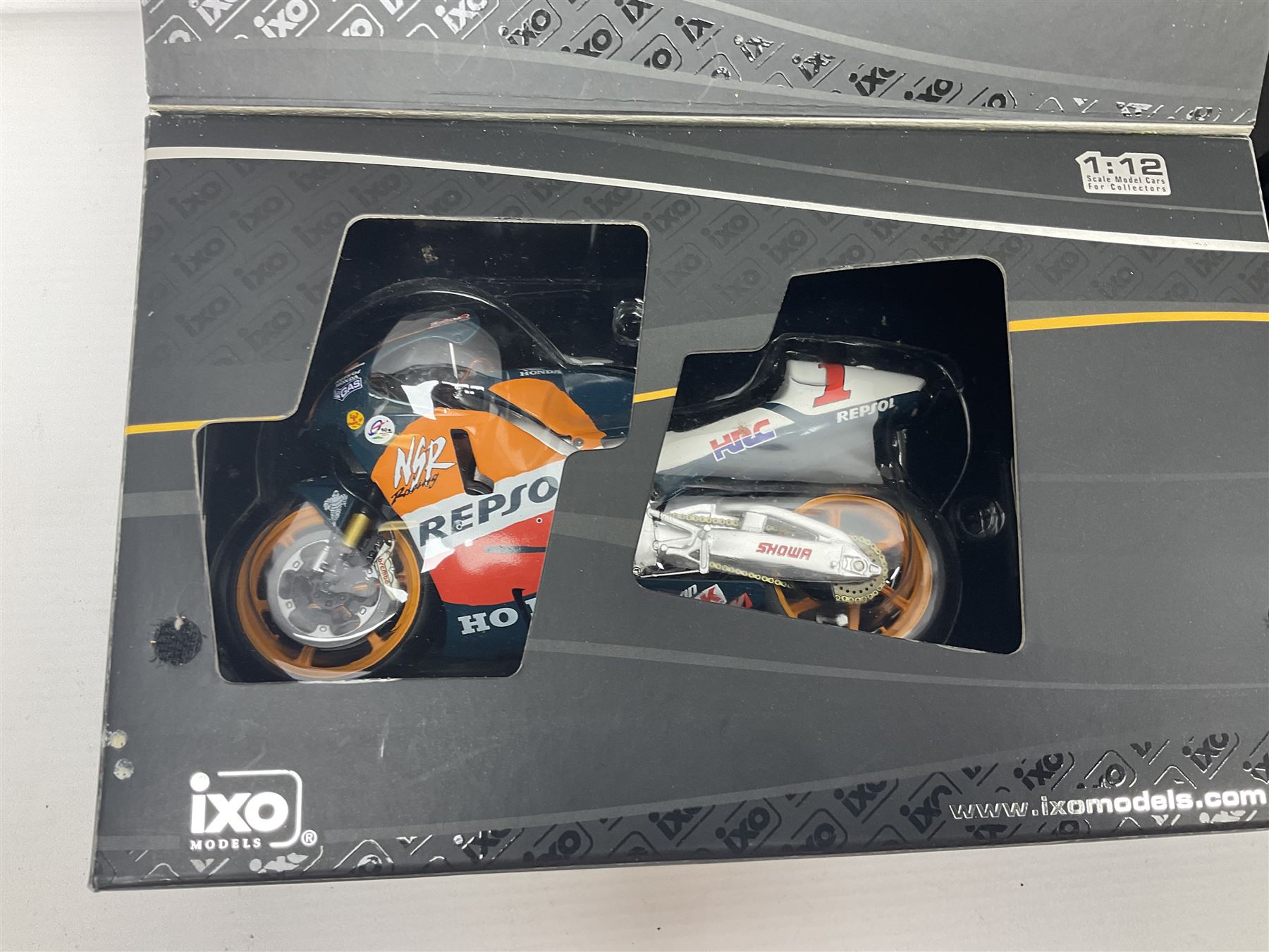 Three Ixo Models 1:12 scale die-cast models of motorcycles - BRB007 Honda NSR500 Michael Doohan 1998; BRB001 Honda RC211V Valentino Rossi 2003; and Yamaha YZR-M1 Colin Edwards MotoGP Phillip Island 2007; all boxed (3)