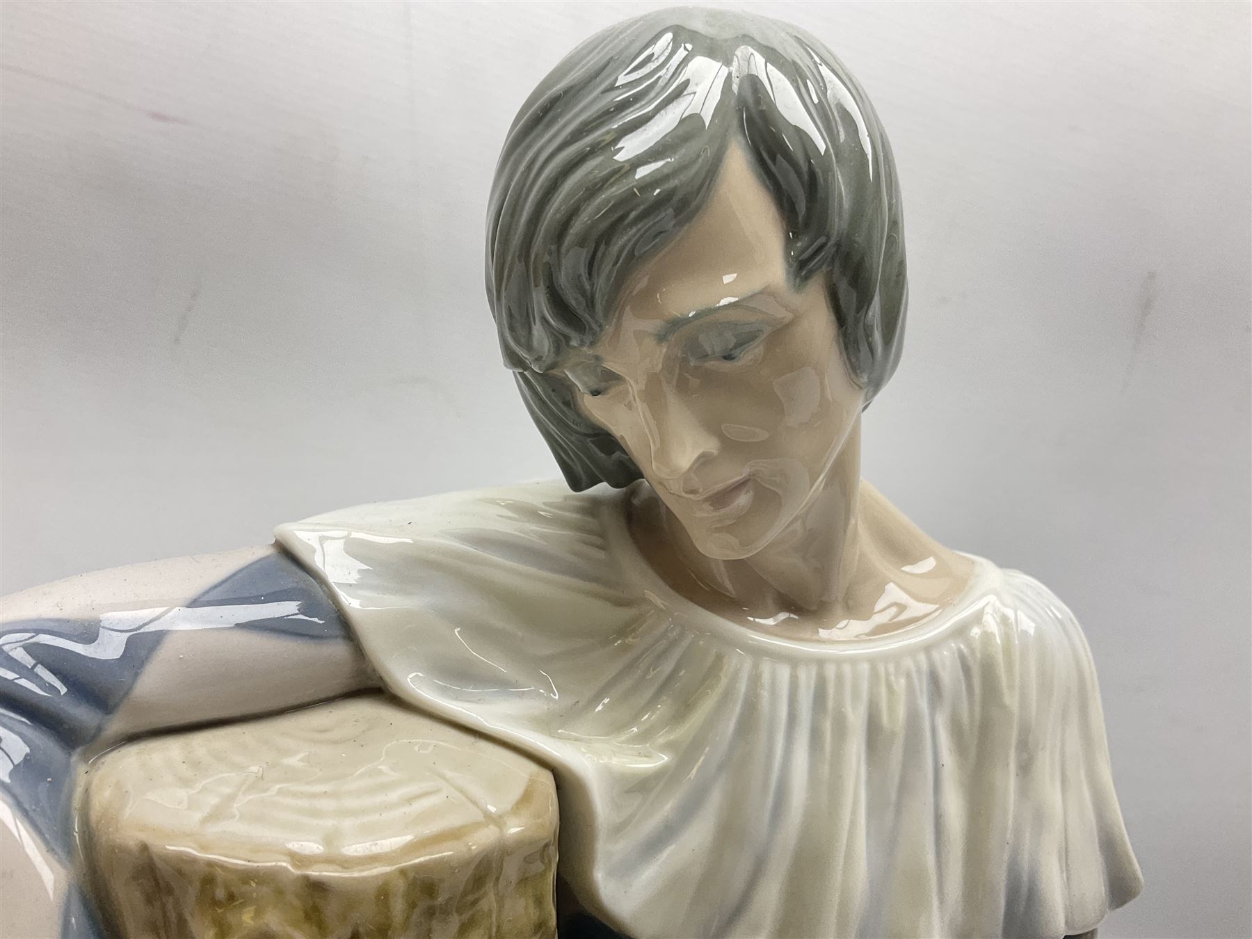 Lladro figure, Harlequin Reclining, modelled as a recumbent harlequin, no 5128, Sculpted by Salvador Furio, year issued 1982, year retired 1987, H28cm 