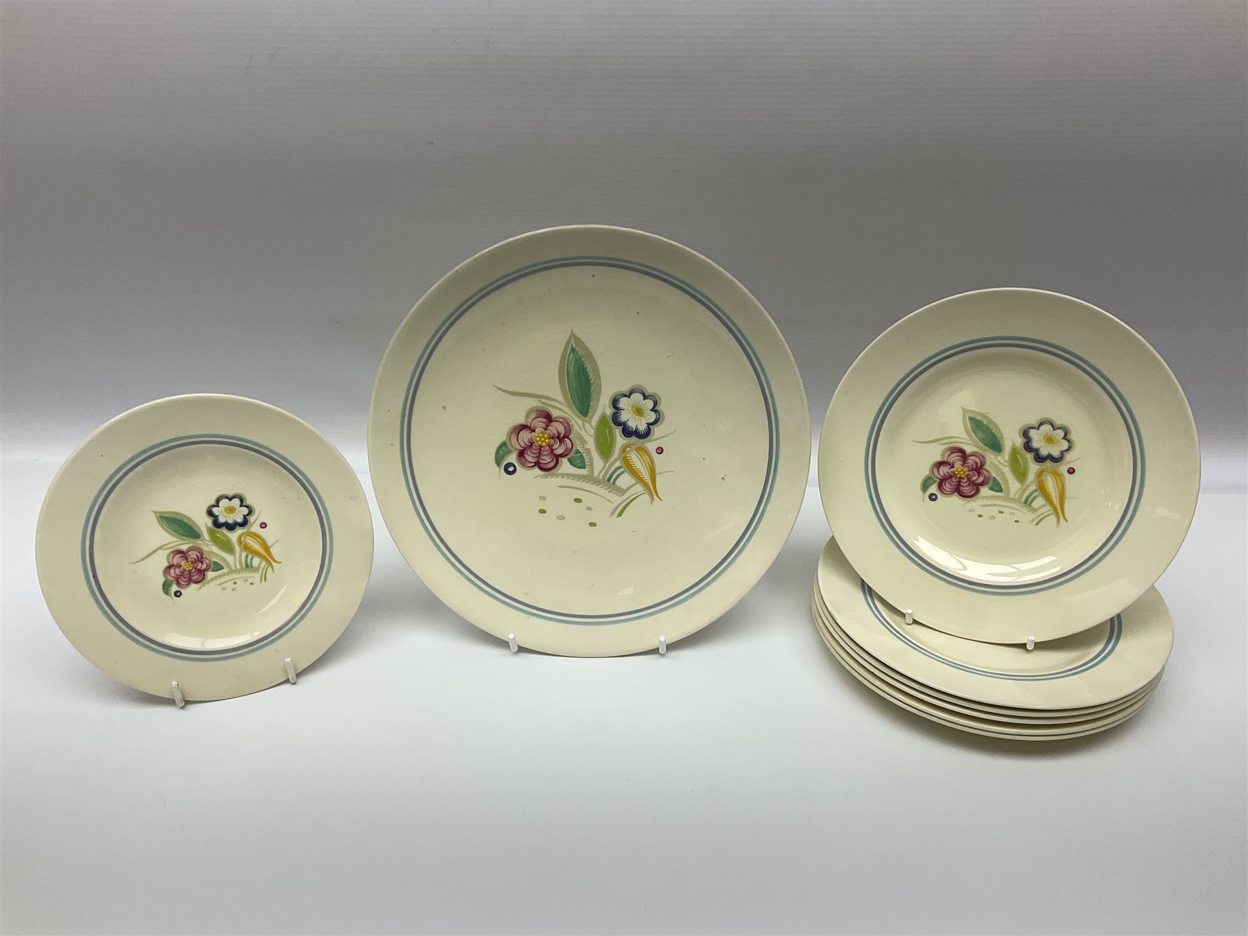 Susie Cooper Nosegay pattern tea service, teapot, eight cups and saucers, six dessert plates, three graduating jugs, covered twin handled sucrier, open sucrier  and cake plate 