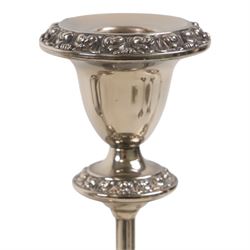 Silver plate two branch candelabra with grape vine decoration to the base, together with a matching pair of candle sticks and other candlesticks  
