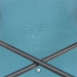 Vitra - Pair of Eames DAW armchairs, moulded plastic seats in teal with integrated armrests, blue upholstered seat cushions, supported on stained wooden dowel legs with black wire cross bracing