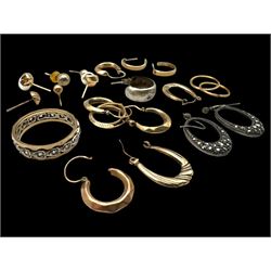 9ct gold earrings, including hoop earrings and knot earrings, together with a 9ct gold paste set eternity ring and a pair of silver marcasite earrings 