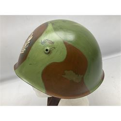 1960s Italian parachutist helmet with liner; camouflage paintwork with parachutist crest to the front