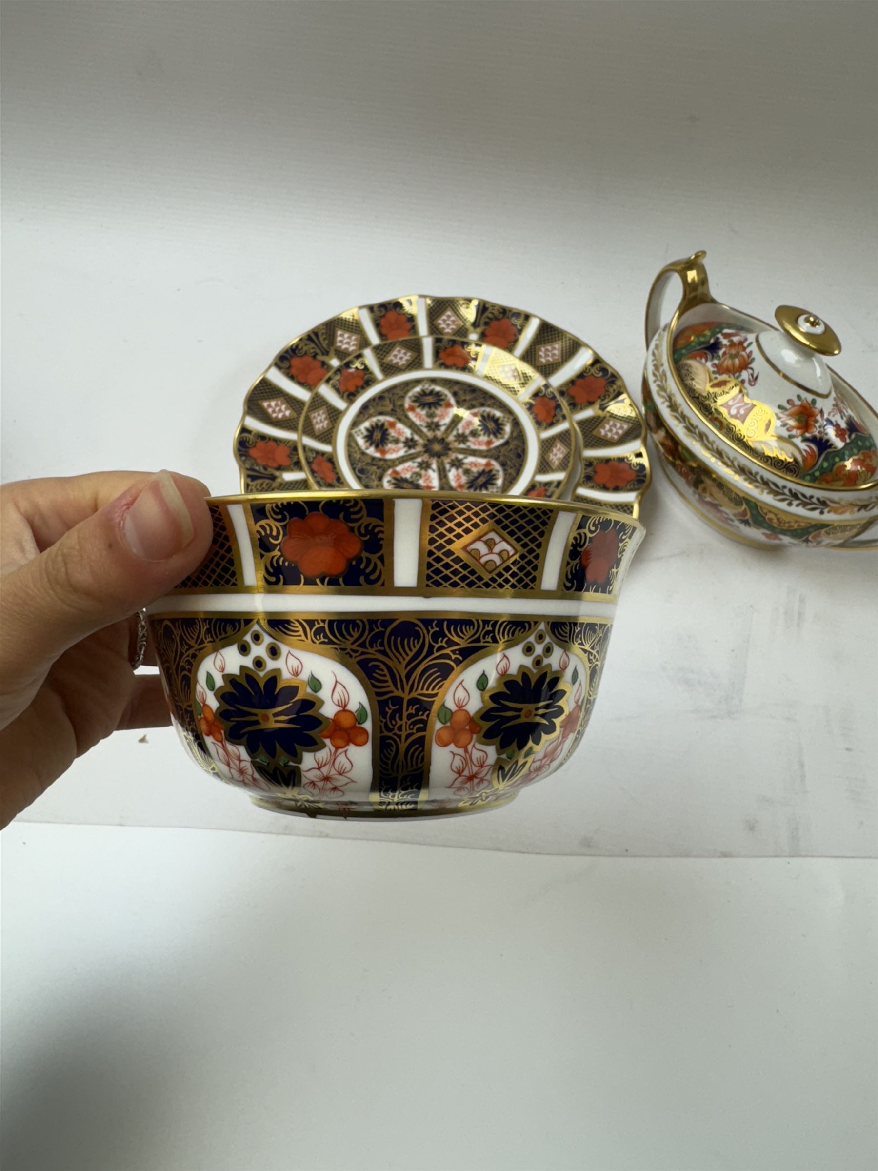 Royal Crown Derby 1128 Old Imari pattern, teacup and saucer, plate with fluted edge and open sucrier, together with spode twin handled sucrier