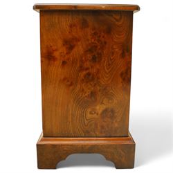 Late 20th century figured walnut miniature chest, the rectangular top with feather banded border over two short and two long drawers, fitted with brass batwing handles, upon moulded plinth base and four bracket feet, H60cm, w67cm, D36cm