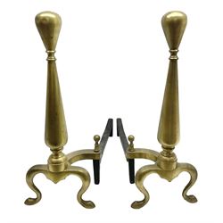 Pair of late 19th/early 20th century heavy brass and iron fire dogs, of tapering form with cabriolet legs and tear shaped finials, marked NEB Co, H49cm