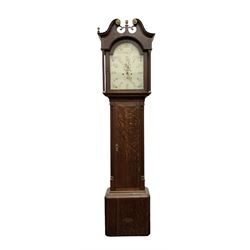 Late 18th century oak 8-day longcase clock, with a swan necked pediment and brass paterie, 
break arch hood door flanked by detached reeded pilasters, trunk with recessed quarter pillars and a long flat topped door, on a square plinth with canted corners, early painted dial with Arabic numerals and floral decoration to the arch and spandrels, with stamped brass hands and date recorder, weight driven two train movement with baluster movement pillars and an internal countwheel strike (bell missing). With pendulum and weights.  No makers name.