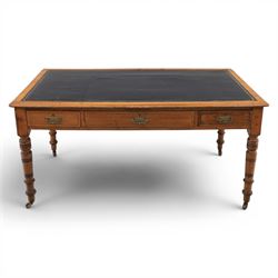 Victorian pitch pine writing table with leather inset top, rectangular top with three frie...