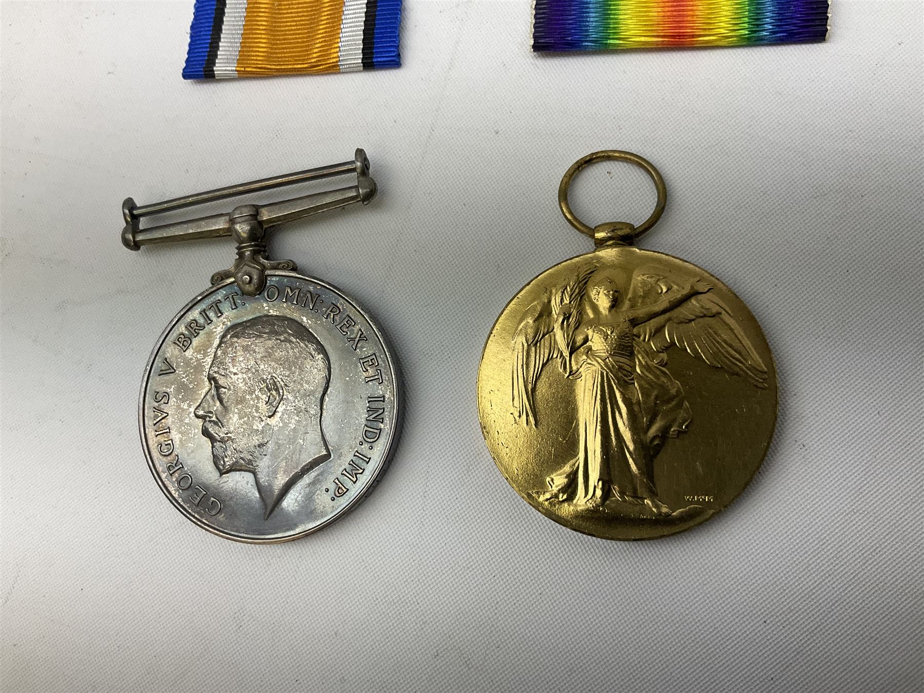 WW1 group of three medals comprising British War Medal and Victory Medal in issue box and Ceylon Volunteer Service Medal awarded to 10288 Pte. M. Smith R. Fus.; together with a later awarded WW2 Defence Medal in modern box with slip; and his QEII Imperial Service Medal in case and box with certificate dated 1959