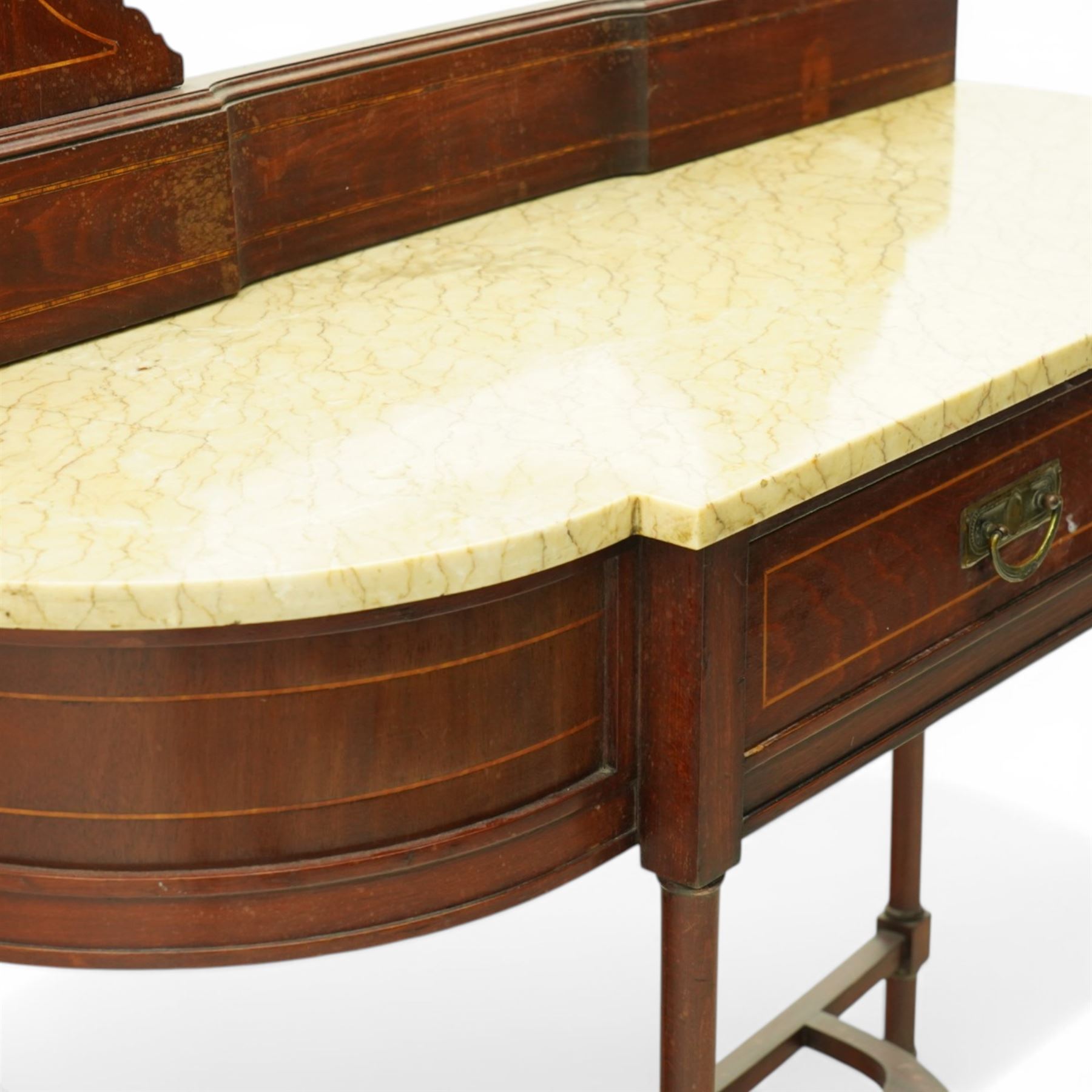 Edwardian inlaid mahogany dressing table, serpentine fronted marble top over central frieze drawer flanked by bowed sides, raised back with line inlaid decoration and oval swing mirror, on slender tapering supports united by shaped undertier